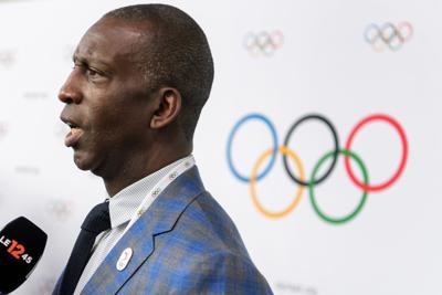 In this photo from July 11, 2017, US Olympic track and field legends Michael Johnson answers to reporters after the Los Angeles 2014 bid presentations before the International Olympic Committee members in Lausanne.