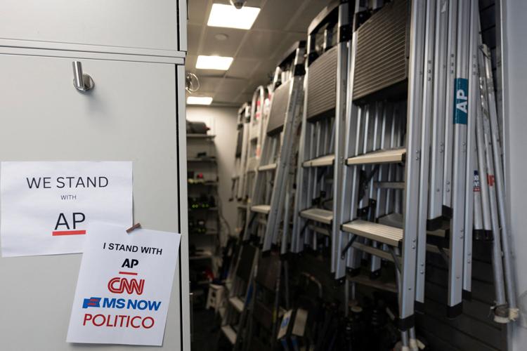 Signs hang in the media work area at the White House after CNN, MS NOW, and Politico were kicked off the White House grounds by US President Donald Trump