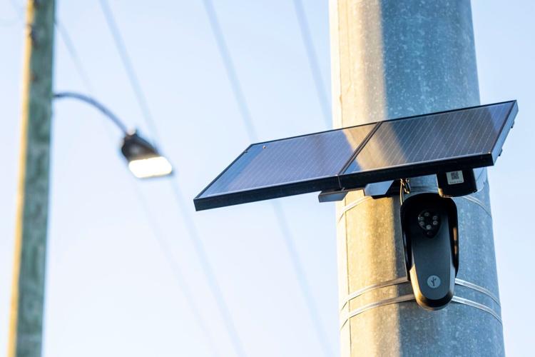 A Flock Camera, an automated license plate reader, hangs on a traffic signal support pole at the intersection of Granby Street and East Little Creek Road in Norfolk on Tuesday, May 21, 2024. A national law firm filed a federal lawsuit on behalf of two l...