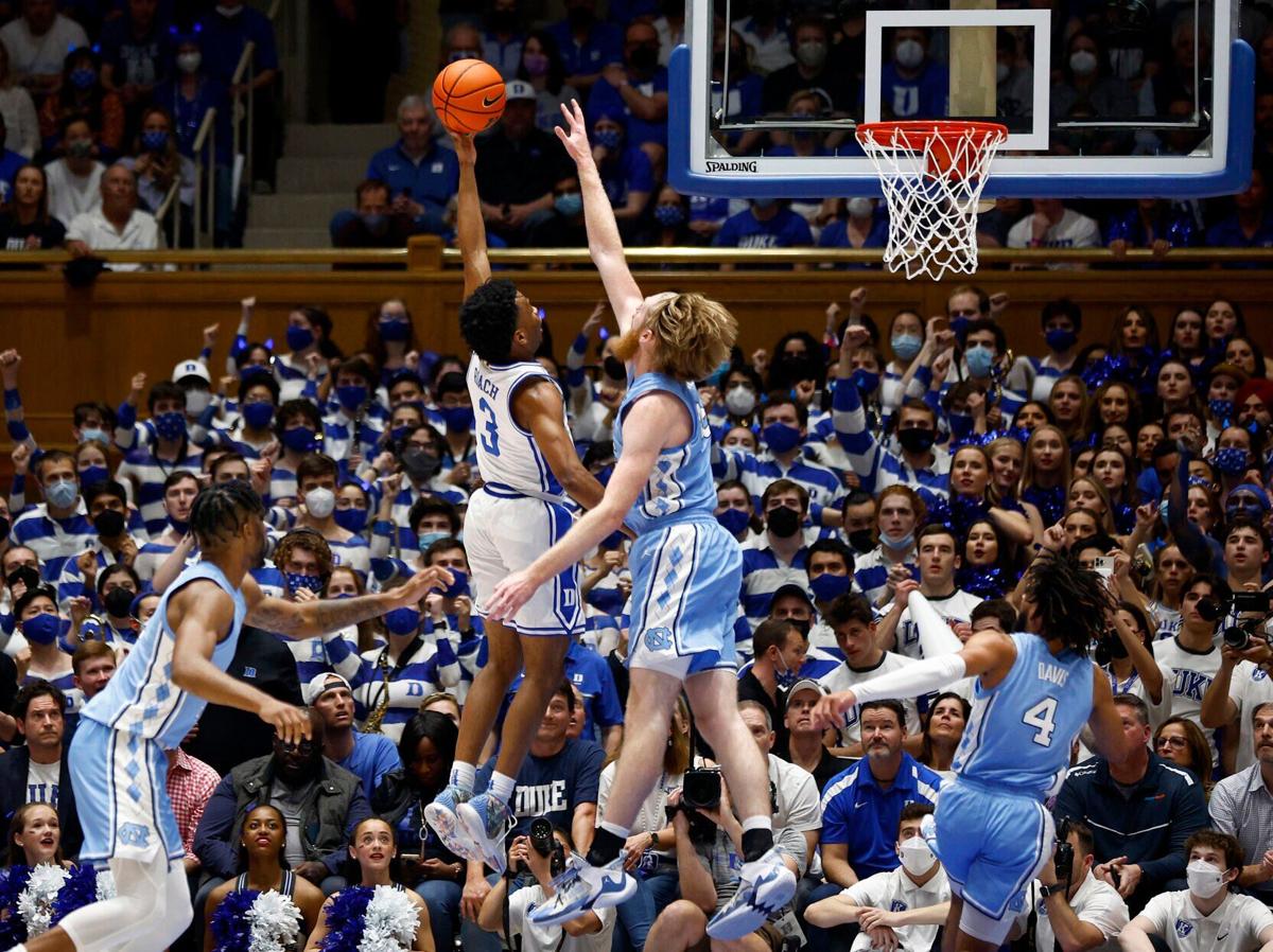 Duke's Jeremy Roach attempts a shot against North Carolina's Brady Manek at Cameron Indoor Stadium on March 5, 2022, in Durham, North Carolina.