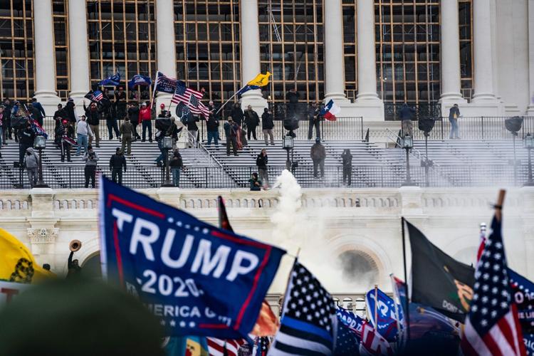 Supporters of US President Donald Trump clash with the US Capitol police during a riot at the US Capitol on Jan. 6, 2021, in Washington, DC.