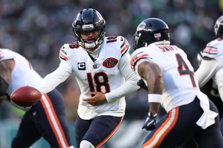 Nov 28, 2025; Philadelphia, Pennsylvania, USA; Chicago Bears quarterback Caleb Williams (18) hands off the ball to Chicago Bears running back D'Andre Swift (4) against the Philadelphia Eagles during the second quarter of the game at Lincoln Financial Field