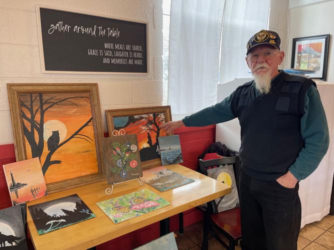Veteran donates paintings to auction off for a good cause