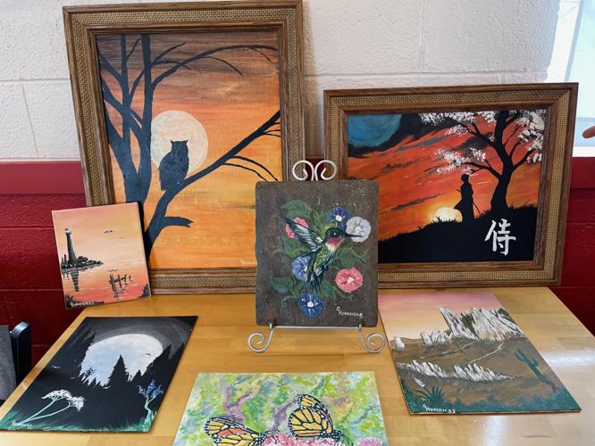 Veteran donates paintings to auction off for a good cause