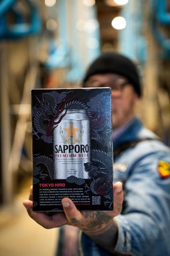 Tokyo Hiro holds 6 pack