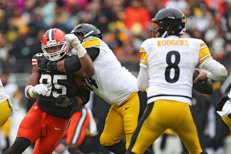 Cleveland Browns defensive end Myles Garrett (95) tries to get past Pittsburgh Steelers guard Spencer Anderson (74) as quarterback Aaron Rodgers (8) looks to throw during the second half of an NFL football game at Huntington Bank Field, Dec. 28, 2025, in C