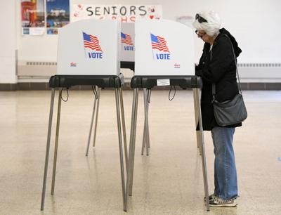Voter Helen Wilson fills out her ballot during the Maryland Primary Election, at Glen Burnie High School on May 14, 2024, in Glen Burnie, Maryland.