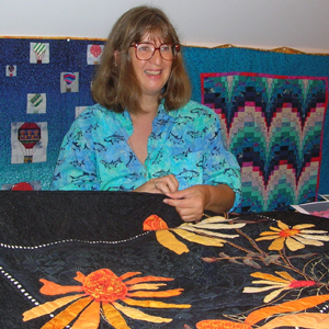 Täuber steps 'out of the box' for traditional art quilting