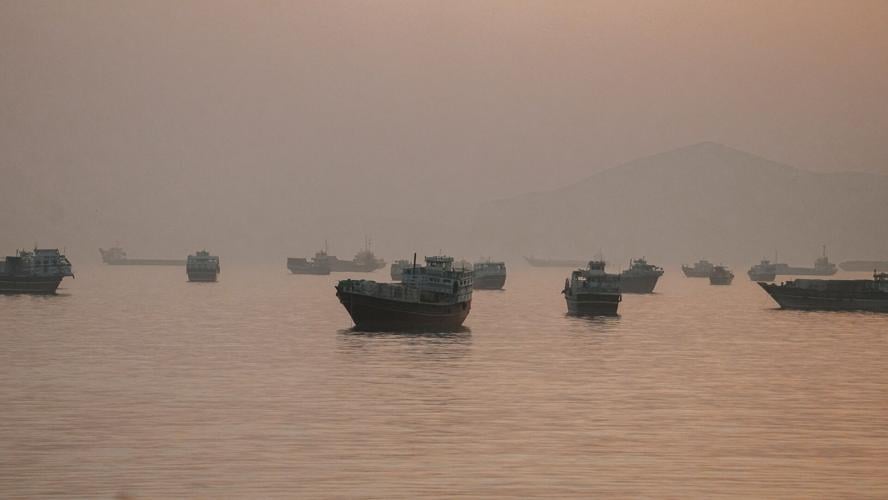 FILE PHOTO: Vessels are anchored in the Strait of Hormuz as seen from Musandam