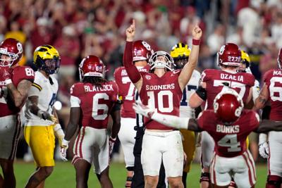 Oklahoma Sooners quarterback John Mateer (10) celebrates after a college football game between the University of Oklahoma Sooners (OU) and the University of Michigan Wolverines at Gaylord Family Ð Oklahoma Memorial Stadium in Norman, Okla., Saturday, Sept