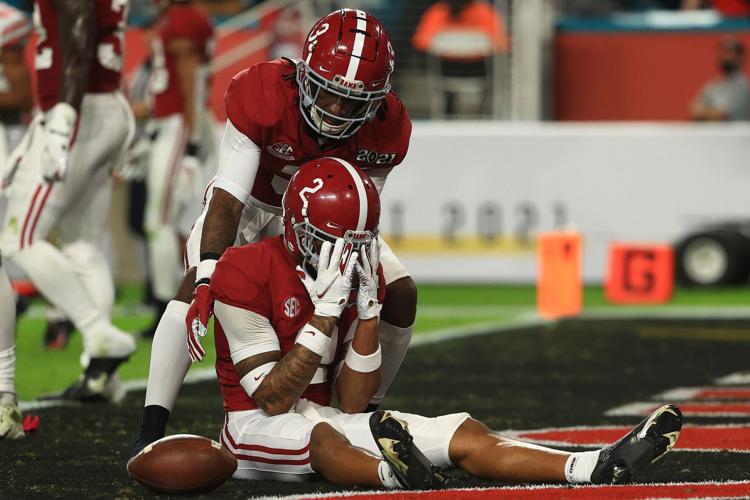 Patrick Surtain II #2 of the Alabama Crimson Tide reacts to missing an interception ahead of Daniel Wright #3 during the second quarter of the College Football Playoff National Championship game against the Ohio State Buckeyes at Hard Rock Stadium on Ja...