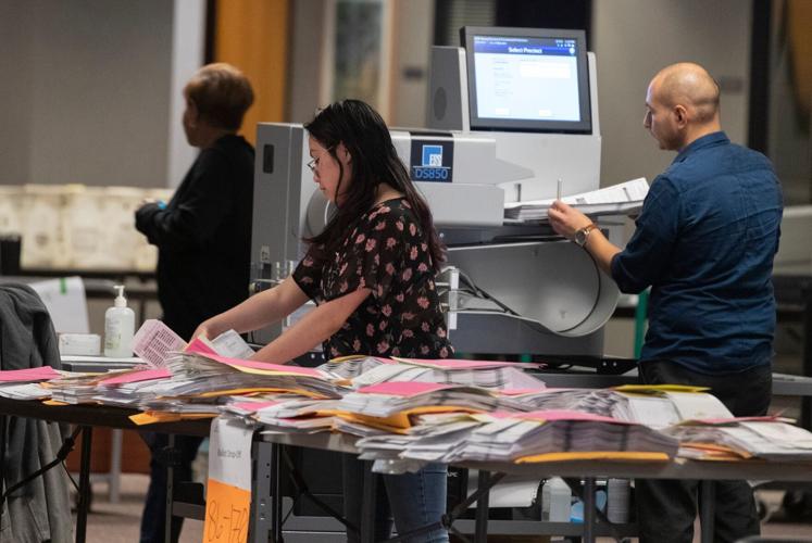 City of Milwaukee Election Commission workers process absentee ballots Tuesday, April 7, 2020 in downtown Milwaukee, Wis. As of Tuesday, more than 860,000 absentee ballots have already been returned to Wisconsin election clerks. MARK HOFFMAN/MILWAUKEE