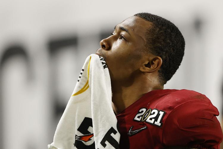 DeVonta Smith #6 of the Alabama Crimson Tide heads to the locker room with a towel covering his right hand during the third quarter of the College Football Playoff National Championship game against the Ohio State Buckeyes at Hard Rock Stadium on Jan. 1...