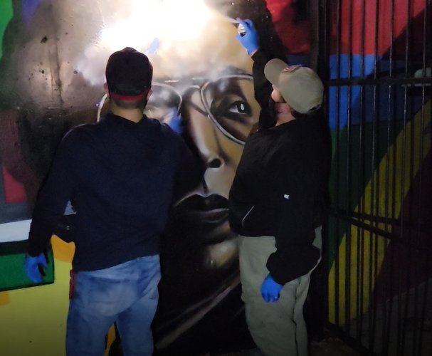 Patriot Front members deface Arthur Ashe on Oct. 18, 2021