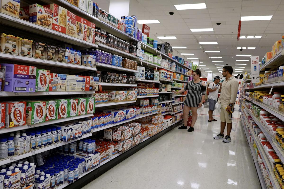 Customers shop at a Target store in Miami. Target announced plans to cut prices on thousands of basics as inflation cuts into household budgets. (Photo by Joe Raedle/Getty Images)
