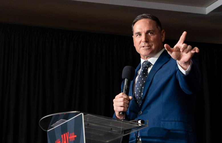 Jay Feely celebrates his victory in the 1st Congressional District GOP primary during a party at Hilton Garden Inn in Scottsdale
