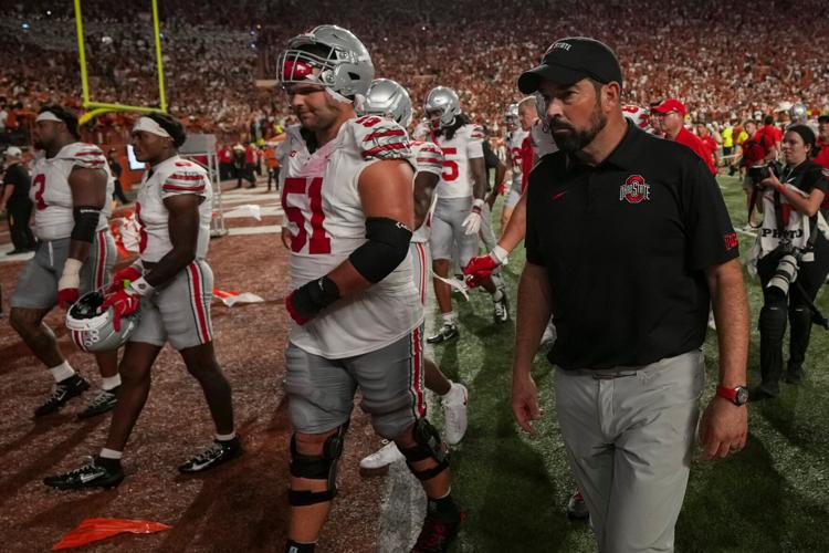 Ohio State Buckeyes head coach Ryan Day watches his players leave the field following the NCAA football game against the Texas Longhorns at Darrell K Royal–Texas Memorial Stadium in Austin, Texas on Sept. 12, 2026. Texas won 24-23.