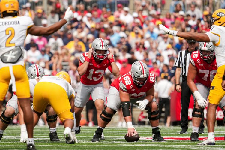 Ohio State quarterback Luke Fahey (13) takes a snap during this team's game against the Kent State at Ohio Stadium in Columbus on Sept. 19, 2026.