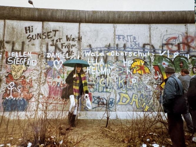 The writer, Lori Rackl, in front of the Berlin Wall shortly after it fell in 1989.