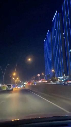 An explosion in the sky from a drone interception, in Erbil