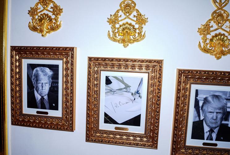 FILE PHOTO: Presidential portraits and framed autopen signing Joe Biden at the White House in Washington