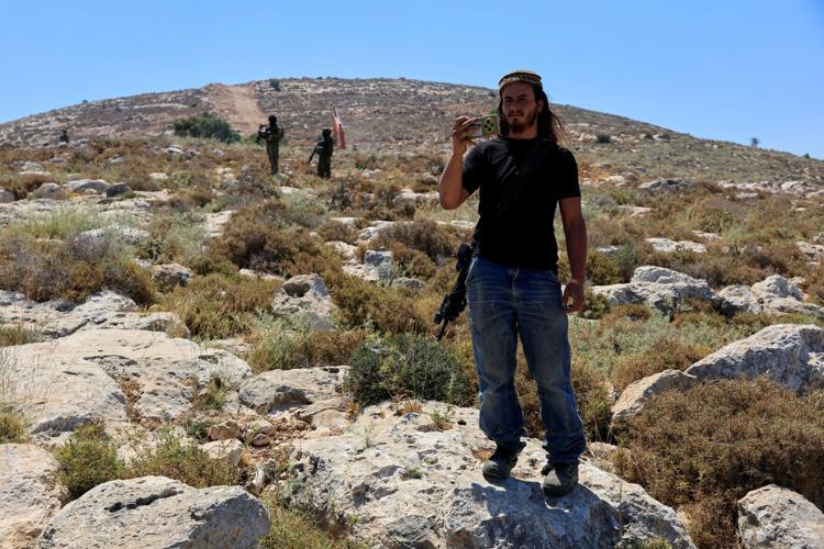 Palestinians protest against a settlement near Hebron