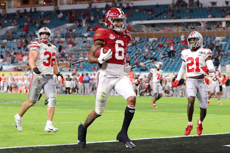 DeVonta Smith #6 of the Alabama Crimson Tide rushes for a 42 yard touchdown during the second quarter of the College Football Playoff National Championship game against the Ohio State Buckeyes at Hard Rock Stadium on Jan. 11, 2021 in Miami Gardens, Flor...
