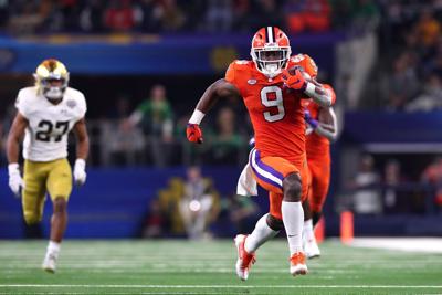 Travis Etienne of the Clemson Tigers runs for a 62- yard touchdown in the third quarter against the Notre Dame Fighting Irish during the College Football Playoff Semifinal Goodyear Cotton Bowl Classic at AT&T Stadium on December 29, 2018 in Arlington, T...