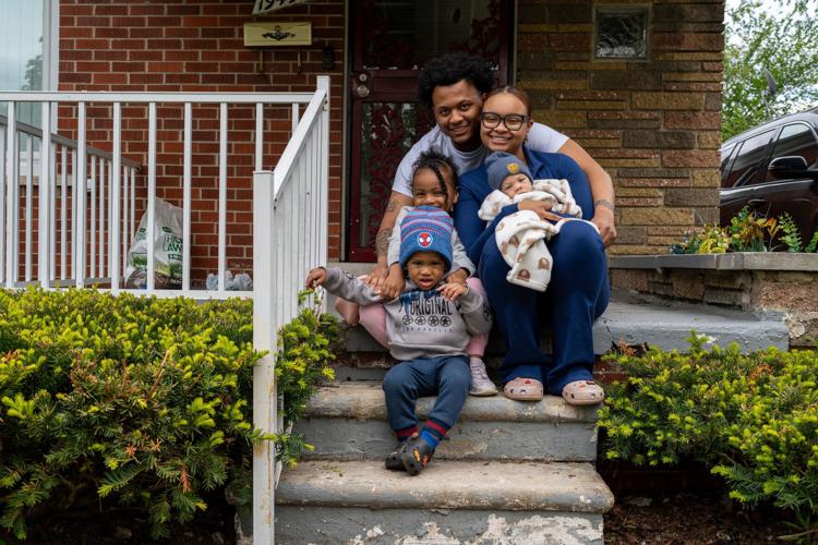Devin Embry, 25, and Desarae Embry, 24, pose for a portrait with their children, Dai’Lani Embry, 4; DJ Embry, 2, and Daviere Embry, 5 months, outside their home in Detroit on Wednesday, May 6, 2026. Desarae said payments through the Rx Kids program have