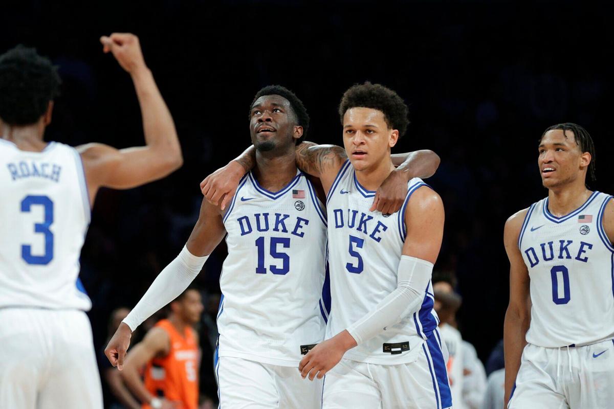 Duke's Paolo Banchero and Mark Williams celebrate amid an 88-79 win against Syracuse in the ACC Tournament quarterfinals at Barclays Center on March 10, 2022, in New York.