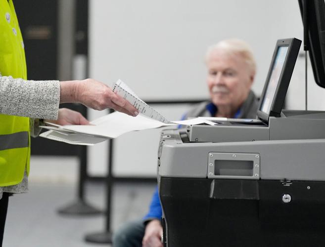 Absentee ballot processor Toni Schnorr processes absentee ballots for the primary election for the District 13 Aldermanic Race at the District 13 polling location in the Northview Building on Tuesday February 17, 2026 in Waukesha, Wisconsin.
