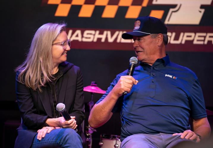 Julie Felss Masino, Cracker Barrel CEO, left, and former stock car driver Michael Waltrip, take part in the announcement for the newly named Cracker Barrel 400 at Gibson Garage in Nashville, Tenn., Thursday, April 10, 2025. Cracker Barrel took over the nam