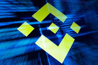 Illustration shows Binance logo and hacker code