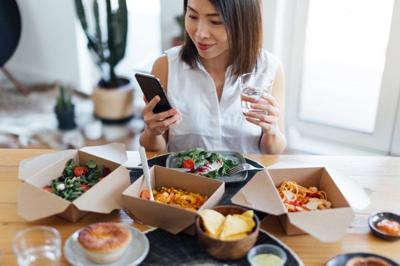 With some cards, you can use your miles to send loved ones a holiday takeout meal.