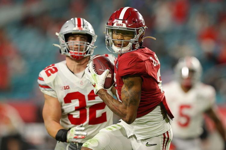 DeVonta Smith #6 of the Alabama Crimson Tide runs for a 42- yard touchdown during the second quarter of the College Football Playoff National Championship game against the Ohio State Buckeyes at Hard Rock Stadium on Jan. 11, 2021 in Miami Gardens, Florida.
