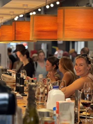 Diners gather around the counter at Si Sea, a popular seafood eatery in Central Market.
