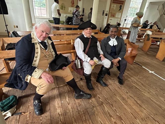 David Scott Taylor (left to right), Coe Kummer and Keith Henley talk about the Revolutionary-era people whose stories they tell in Philadelphia's historic district.