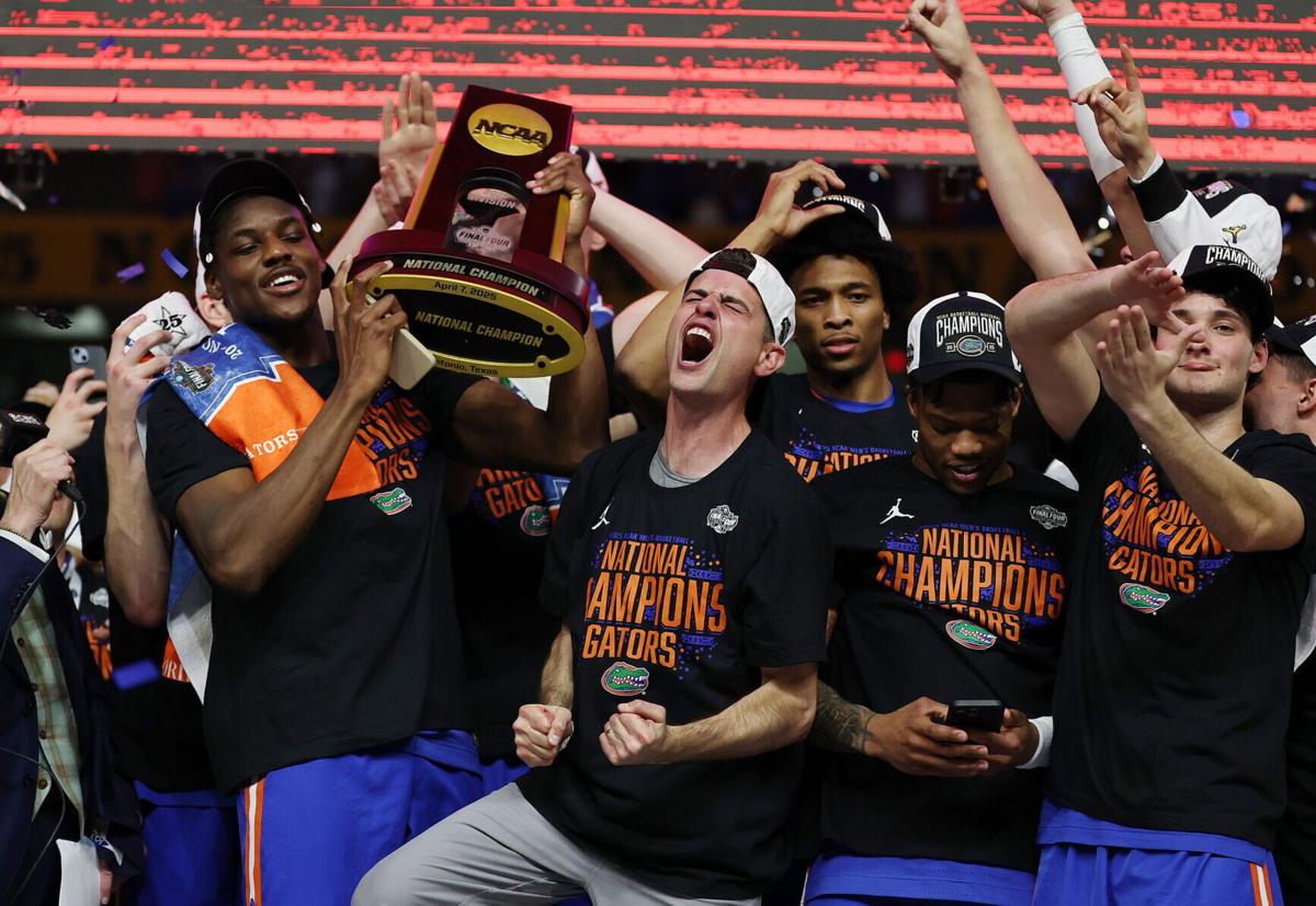 Florida head coach Todd Golden, middle, screams as he and players celebrate after winning the NCAA Tournament National Championship Game against Houston at the Alamodome in San Antonio, Texas, on April 7, 2025.