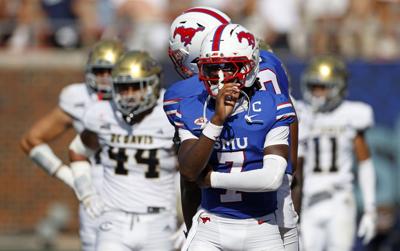 SMU quarterback Kevin Jennings celebrates after throwing a touchdown pass against UC Davis during the first half at Gerald J. Ford Stadium on Saturday, Sept. 12, 2026, in Dallas.