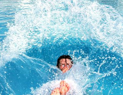 The hotel pool was packed with people, many of whom had their children of all ages in the pool with them.