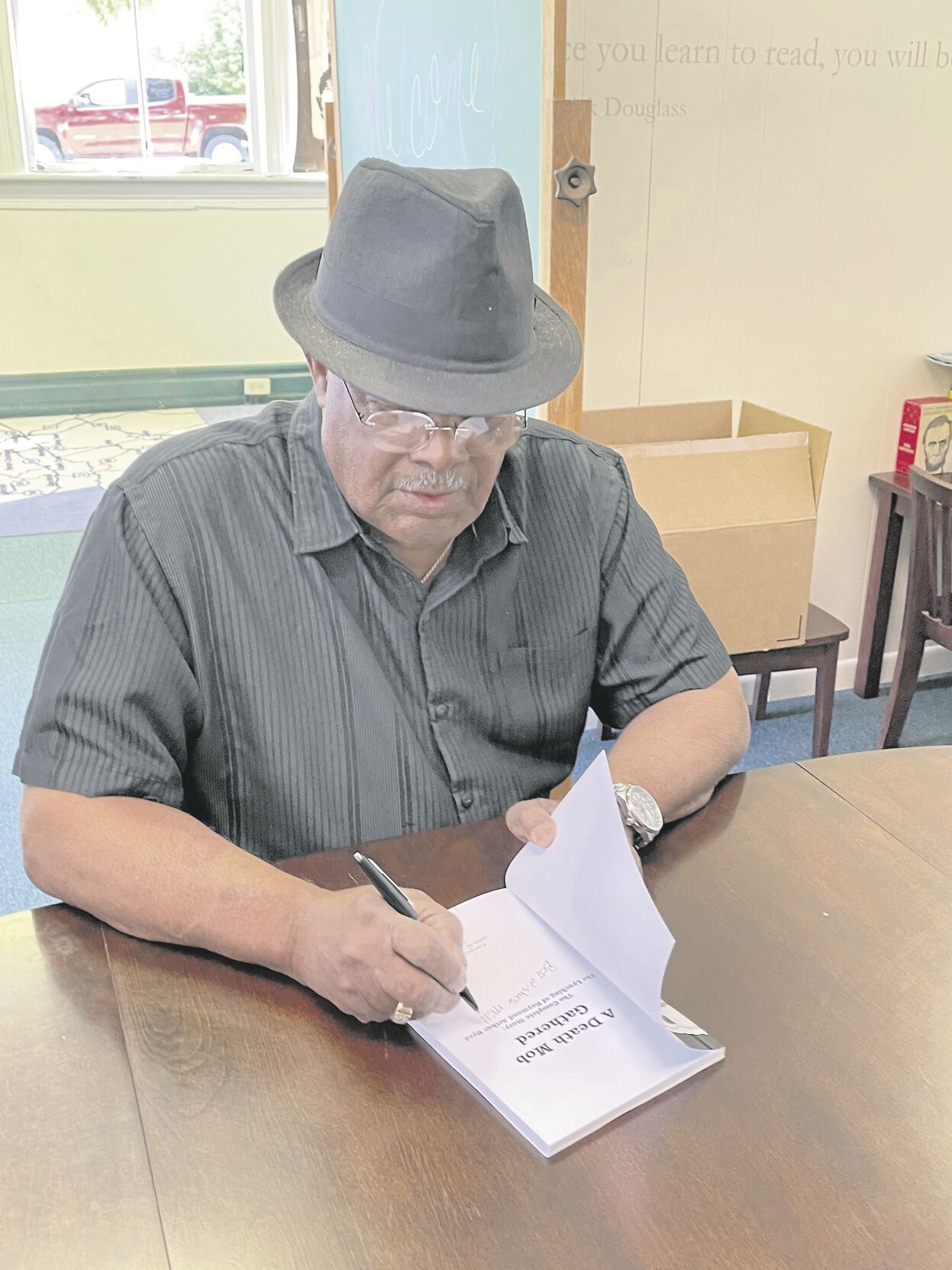 John Johnson signs book pic