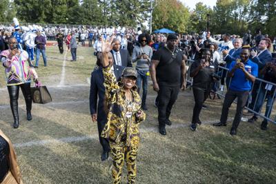 Missy Elliott waves toward fans at the dedication of Missy Elliott Boulevard at Manor High School in Portsmouth, Virginia on Oct. 17, 2022.