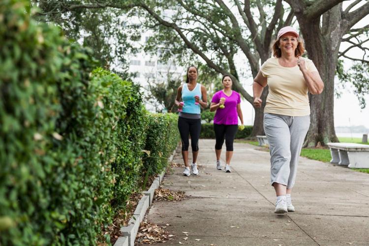 Women exercising in park