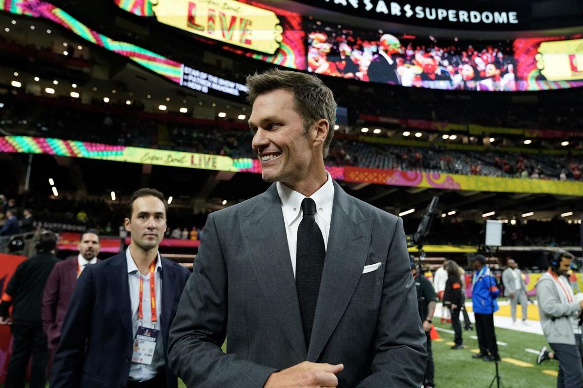 Retired football player and Fox analyst Tom Brady walks the sidelines before the start of Super Bowl LIX between the Kansas City Chiefs and the Philadelphia Eagles at Caesars Superdome in New Orleans, Louisiana, on Feb. 9, 2025.