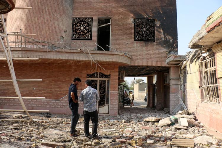 Rubble lies around damaged houses following a reported attack near a wedding gathering in Kuhistik