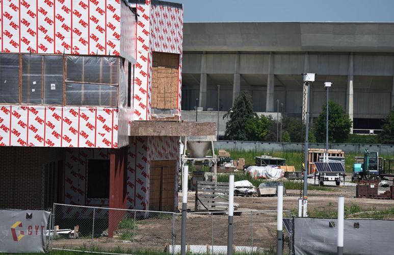 Crews work on the under-construction McFarland Clinic at the CyTown entertainment complex on July 27, 2026, in Ames, Iowa,