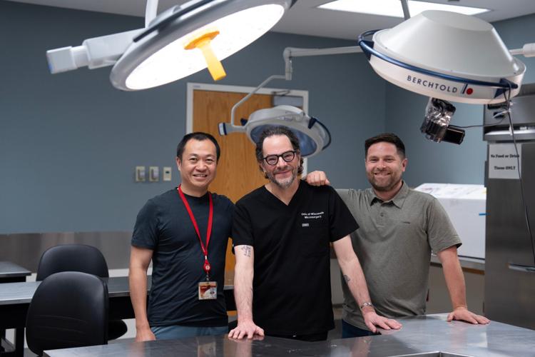 Weifeng Zeng, senior scientist of UW Microsurgery, Dr. Samuel Poore, chair of the UW Division of Plastic Surgery, and Dr. Aaron Dingle, assistant professor in the division, pose for a portrait in the UW Microsurgery Regenerative Medicine Lab.