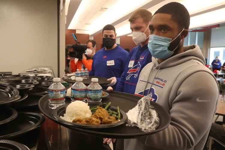 Bills coach Finner serves food at City Mission