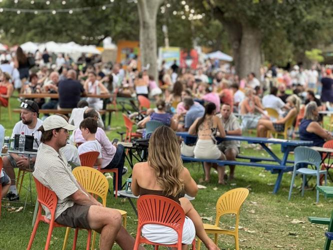 Crowds gather to eat and drink outside performance venues at Adelaide Fringe, scheduled for Feb. 19-March 21 of next year.