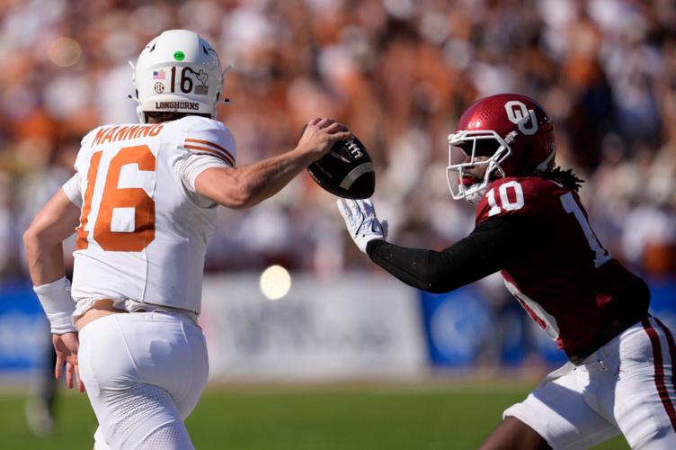 Oklahoma's Kip Lewis (10) chases down Texas' Arch Manning (16) in the first half of the Red River Rivalry college football game